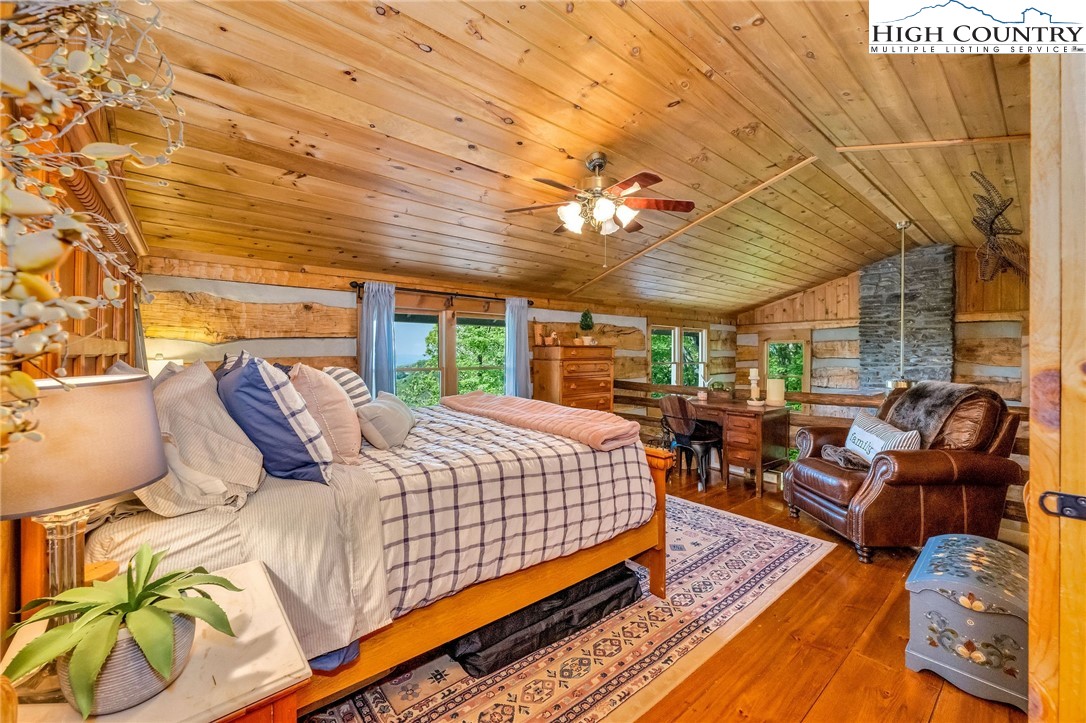 289 Summit Drive Todd, NC 28684 - Photo 28 of 42 a bed room with a bed and a couch