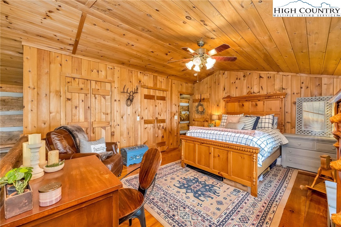 289 Summit Drive Todd, NC 28684 - Photo 30 of 42 a bedroom with a bed and wooden floor