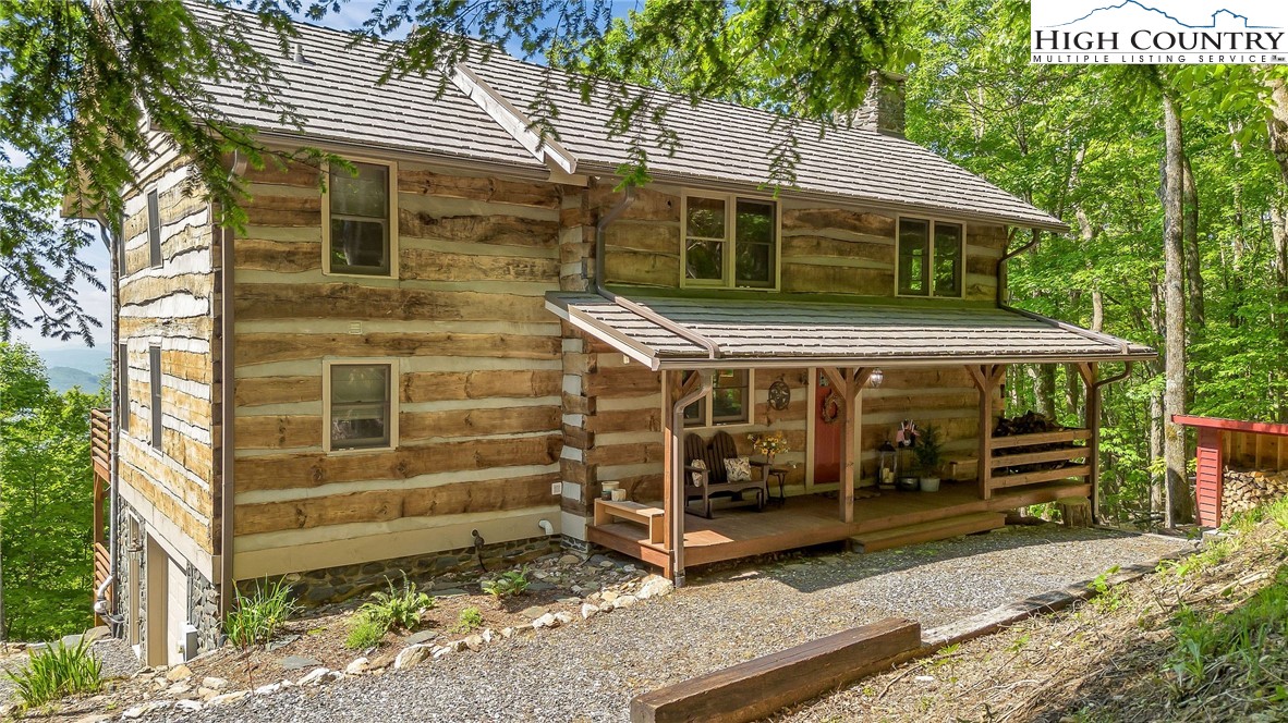 289 Summit Drive Todd, NC 28684 - Photo 3 of 42 a front view of a house with a yard