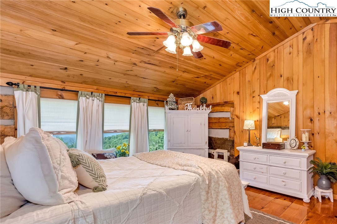 289 Summit Drive Todd, NC 28684 - Photo 35 of 42 a large bed sitting in a bedroom next to a window