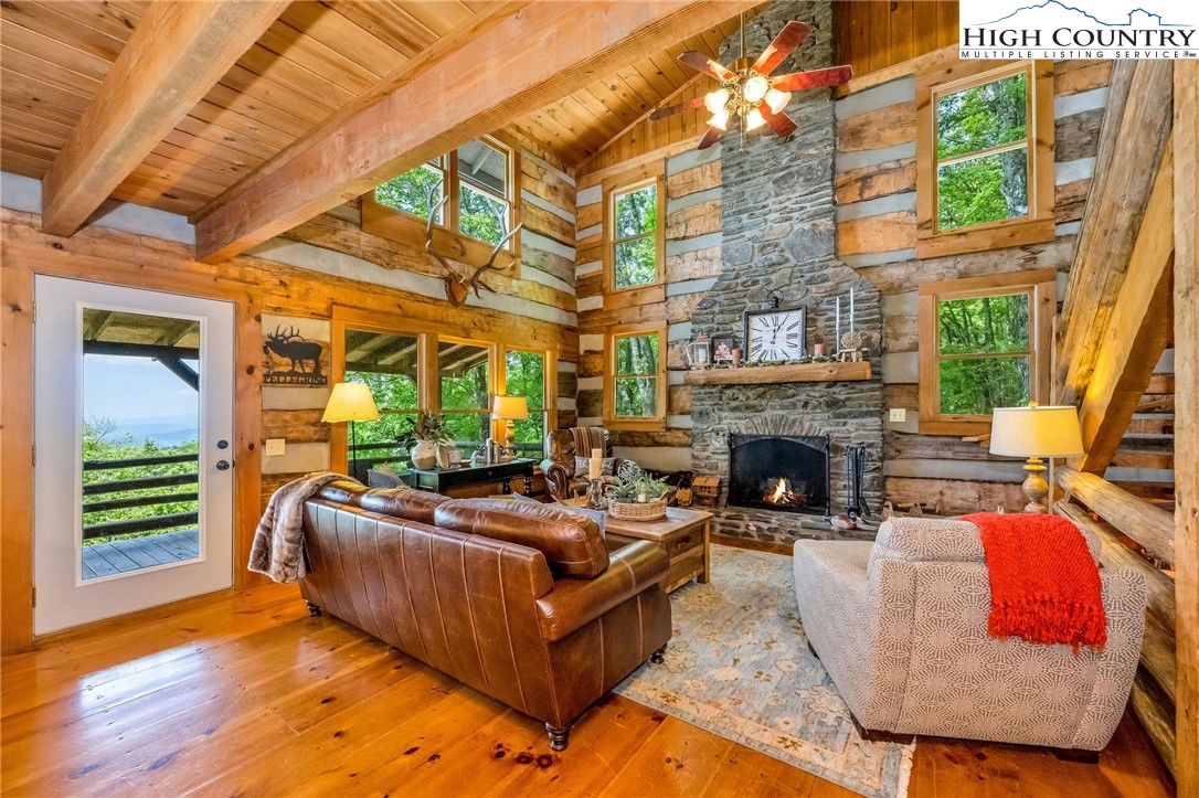 289 Summit Drive Todd, NC 28684 - Photo 7 of 42 a living room with furniture fireplace and flat screen tv