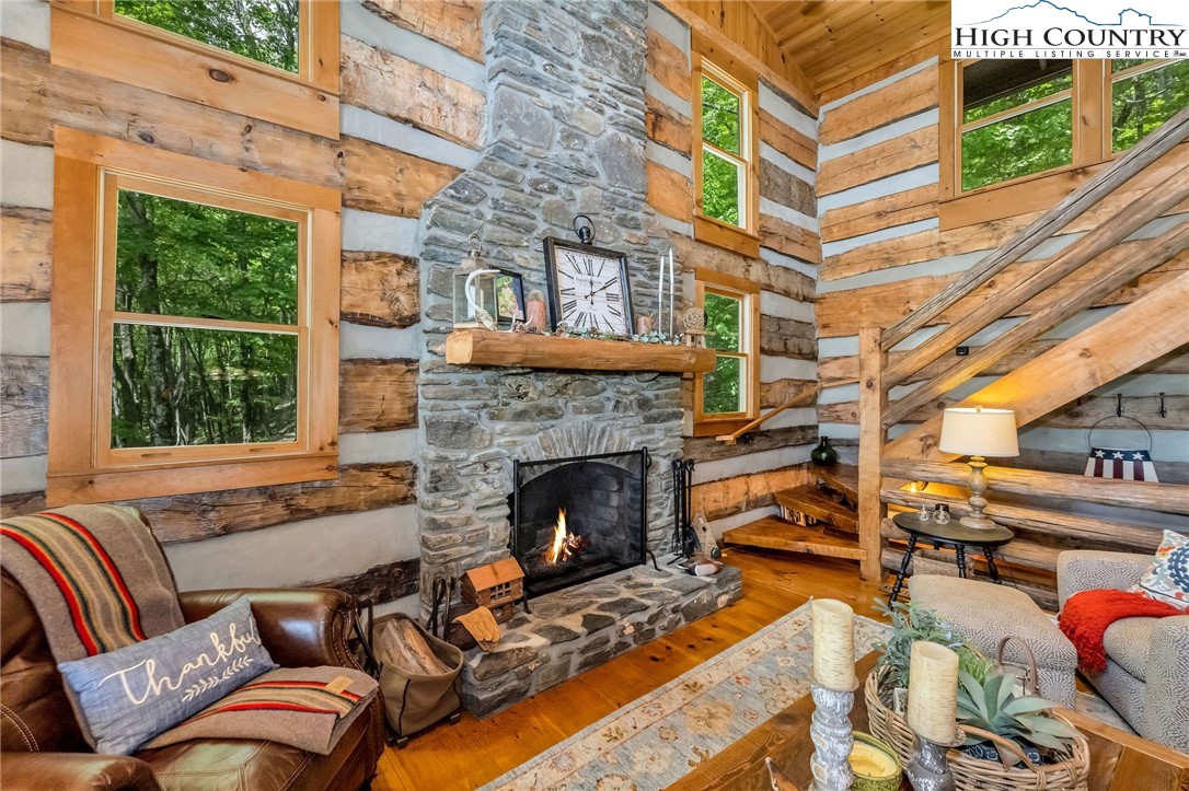 289 Summit Drive Todd, NC 28684 - Photo 8 of 42 a living room with furniture and a fireplace