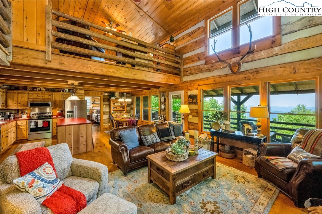 289 Summit Drive Todd, NC 28684 - Photo 9 of 42 a outdoor living space with patio furniture and a potted plant