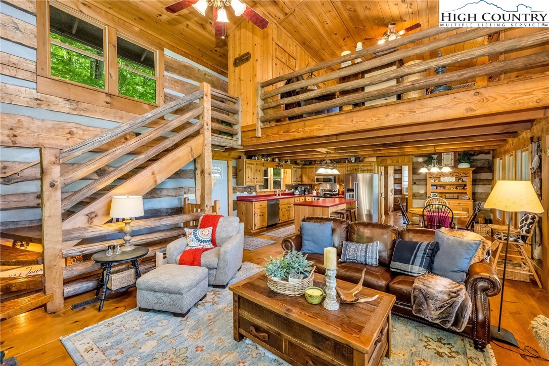 289 Summit Drive Todd, NC 28684 - Photo 10 of 42 a living room with lots of furniture and a potted plant