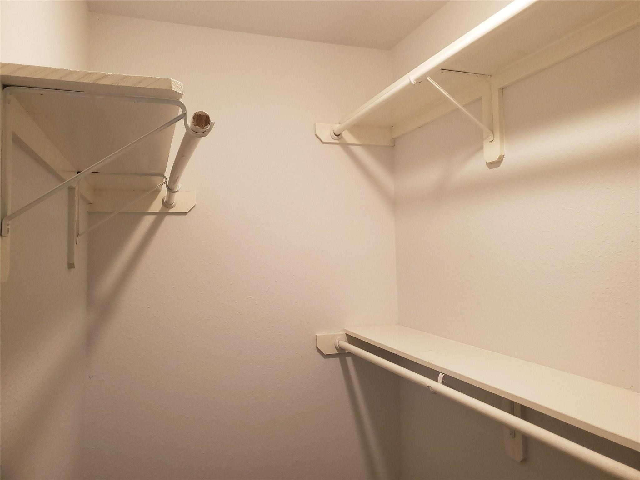 628 Luke Street, Unit A Dayton, TX 77535 - Photo 11 of 26 a view of a room with racks on the wall