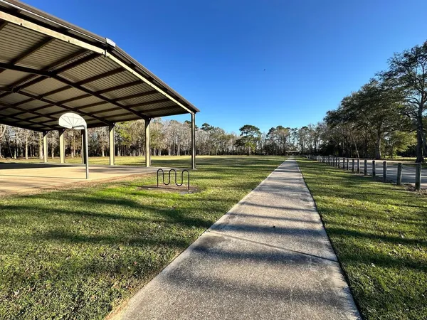 a view of park with iron fence
