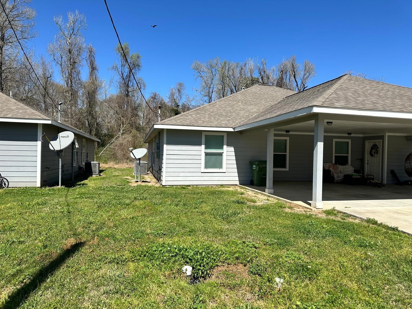 628 Luke Street, Unit A Dayton, TX 77535 - Photo 26 of 26 a view of a house with yard and tree s
