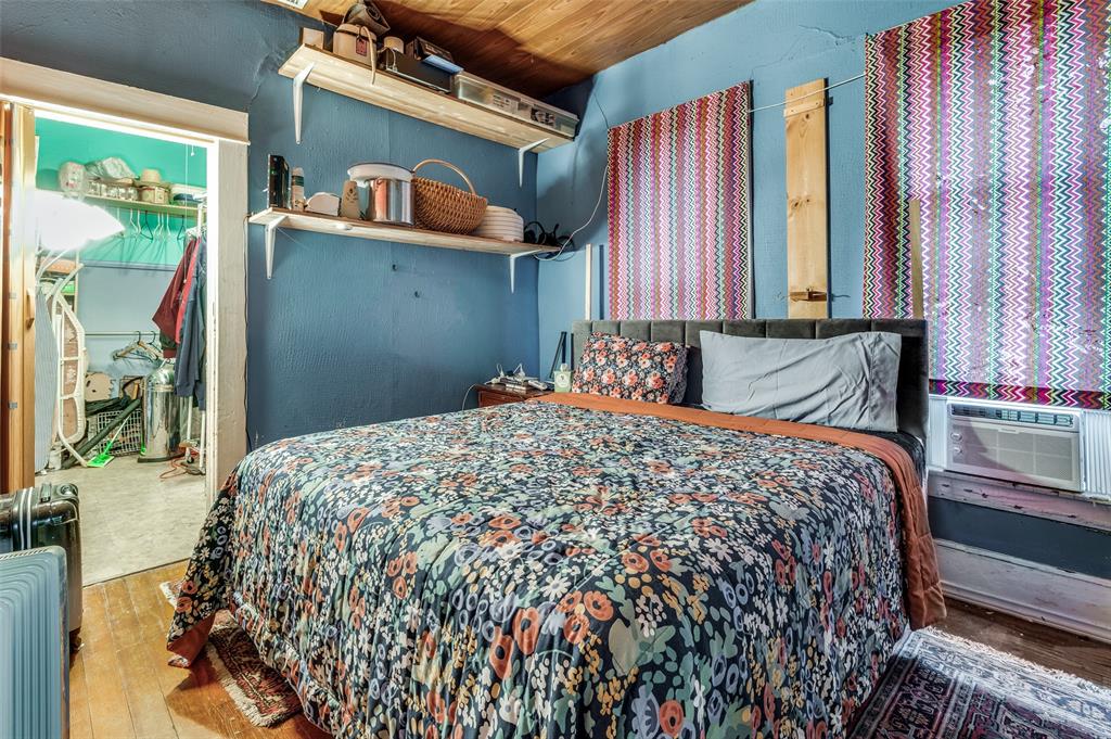 904 Haines Avenue Dallas, TX 75208 - Photo 10 of 24 a bedroom with a bed and a window