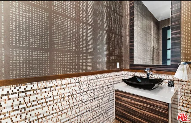 a bathroom with a sink a bathtub and a shower