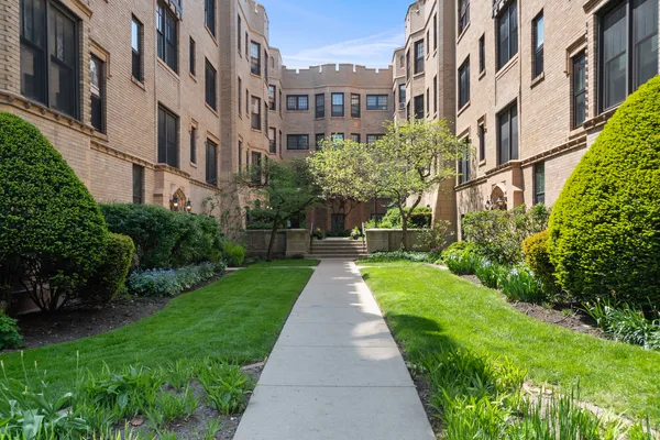 a view of buildings with garden