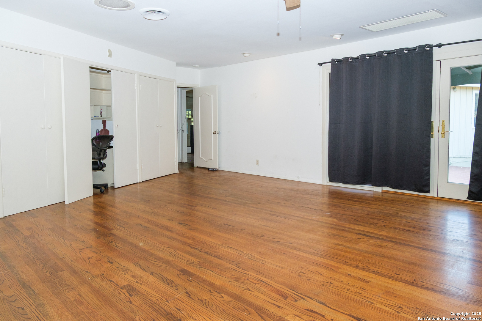 109 Dover Road San Antonio, TX 78209 - Photo 12 of 25 a view of an empty room with wooden floor