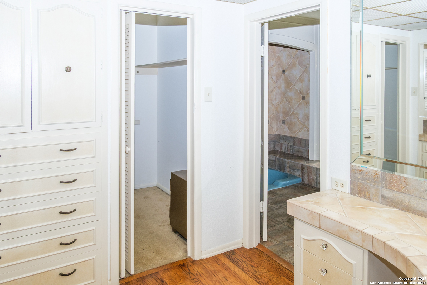 109 Dover Road San Antonio, TX 78209 - Photo 13 of 25 a bathroom with a granite countertop sink and a mirror