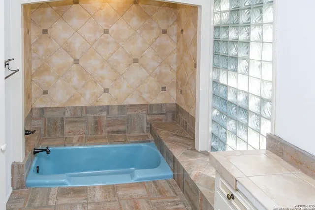a bathroom with a bathtub