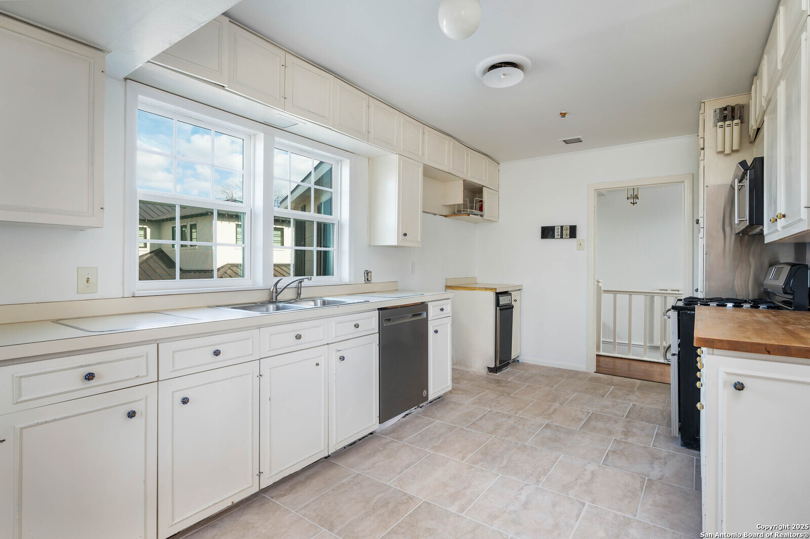 109 Dover Road San Antonio, TX 78209 - Photo 3 of 25 a kitchen with sink cabinets and appliances