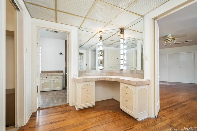 a bathroom with a shower and a sink