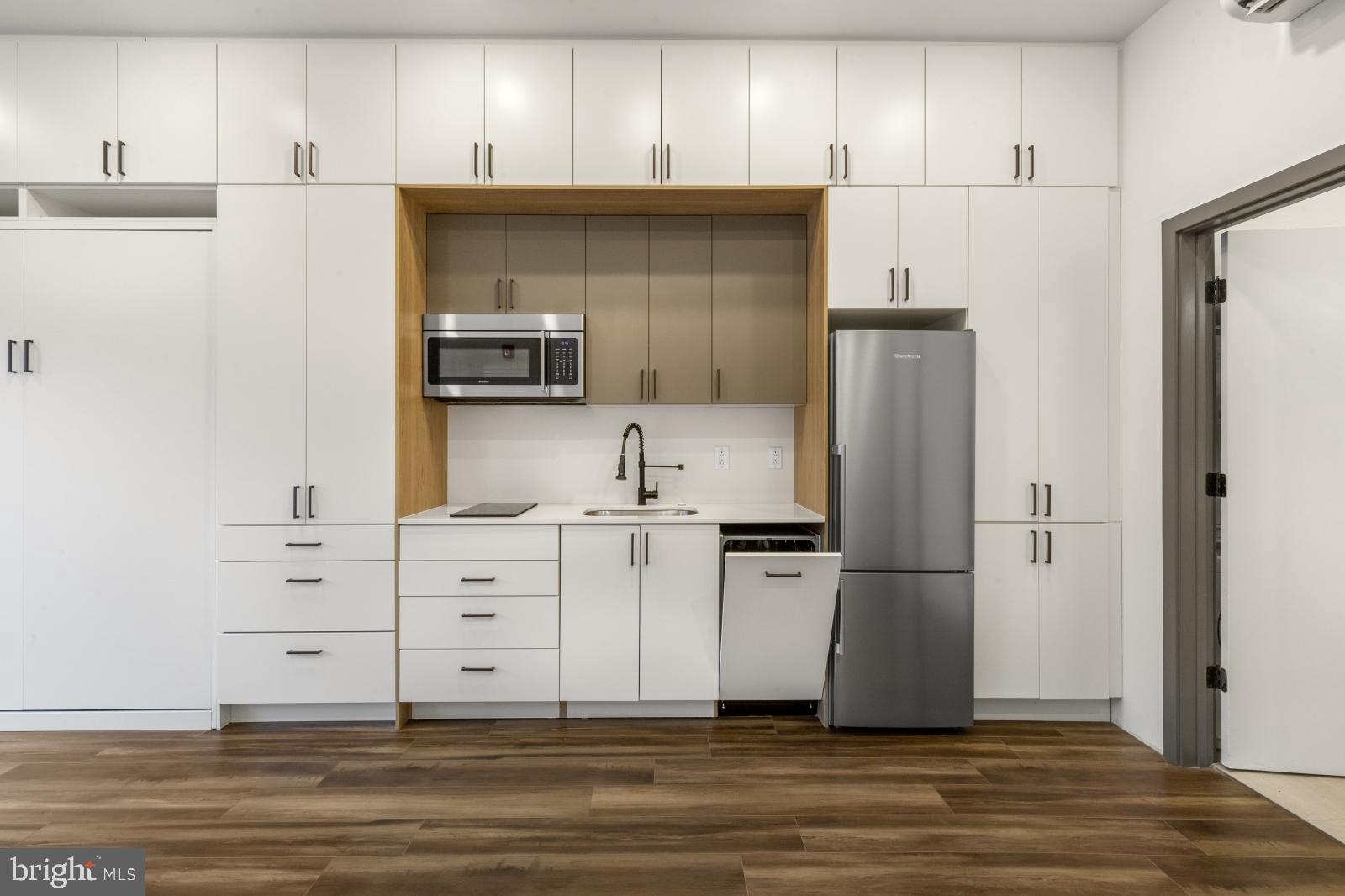 1935 East Hazzard Street, Unit 201 Philadelphia, PA 19125 - Photo 2 of 20 a kitchen with stainless steel appliances a refrigerator and cabinets