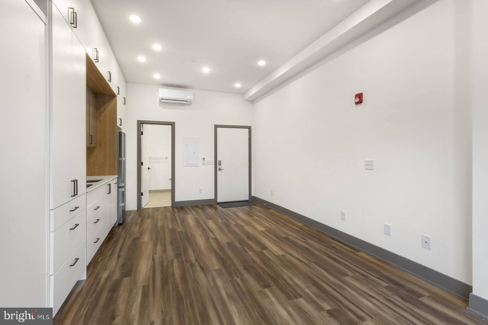 1935 East Hazzard Street, Unit 201 Philadelphia, PA 19125 - Photo 6 of 20 a view of an empty room with wooden floor
