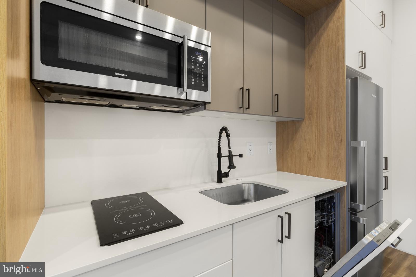 1935 East Hazzard Street, Unit 201 Philadelphia, PA 19125 - Photo 7 of 20 a kitchen with a sink and cabinets