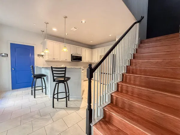 a view of entryway and hall with dining room