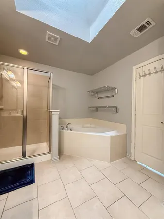 a bathroom with a bathtub and a shower