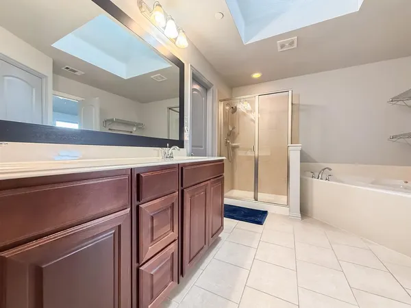 a kitchen with a refrigerator sink and cabinets