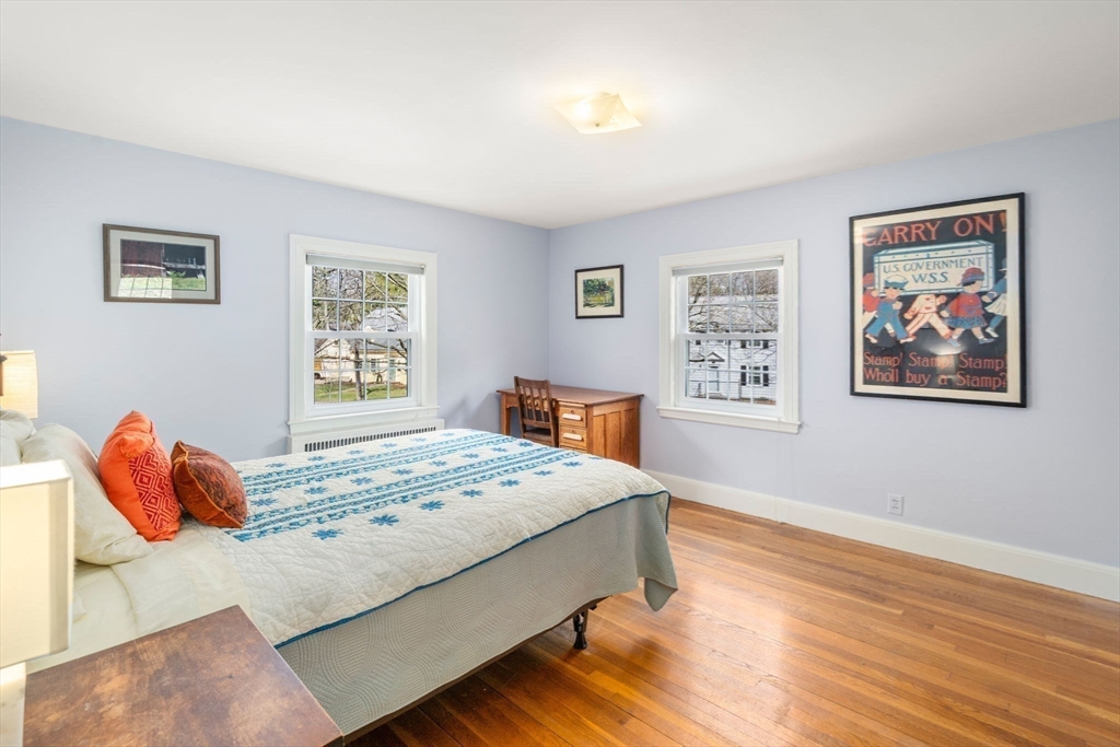 43 Palmer Road Newton, MA 02468 - Photo 20 of 40 a bedroom with a bed and painting on the wall