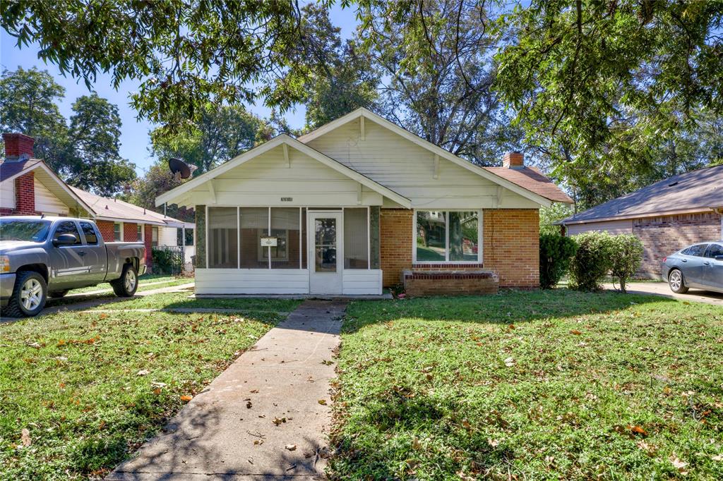 3238 Kinmore Street Dallas, TX 75223 - Photo 1 of 12 a front view of a house with garden