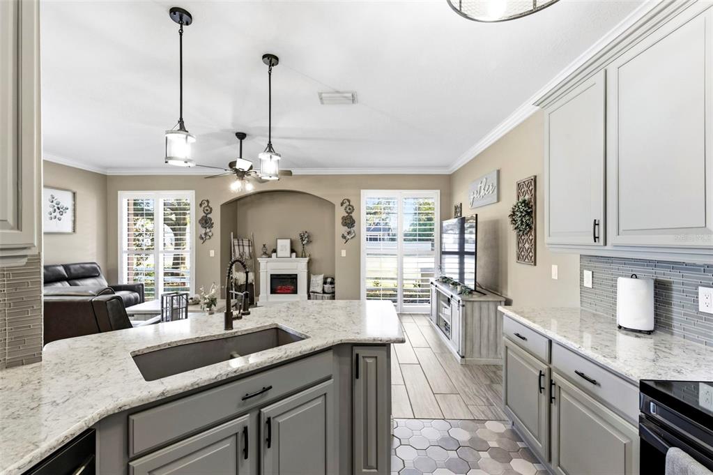 8408 Shallow Creek Court New Port Richey, FL 34653 - Photo 16 of 47 a kitchen with sink cabinets and window
