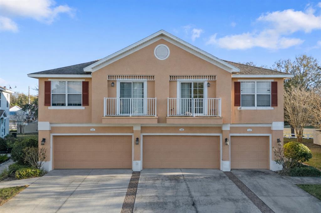 8408 Shallow Creek Court New Port Richey, FL 34653 - Photo 2 of 47 a front view of a house with a yard