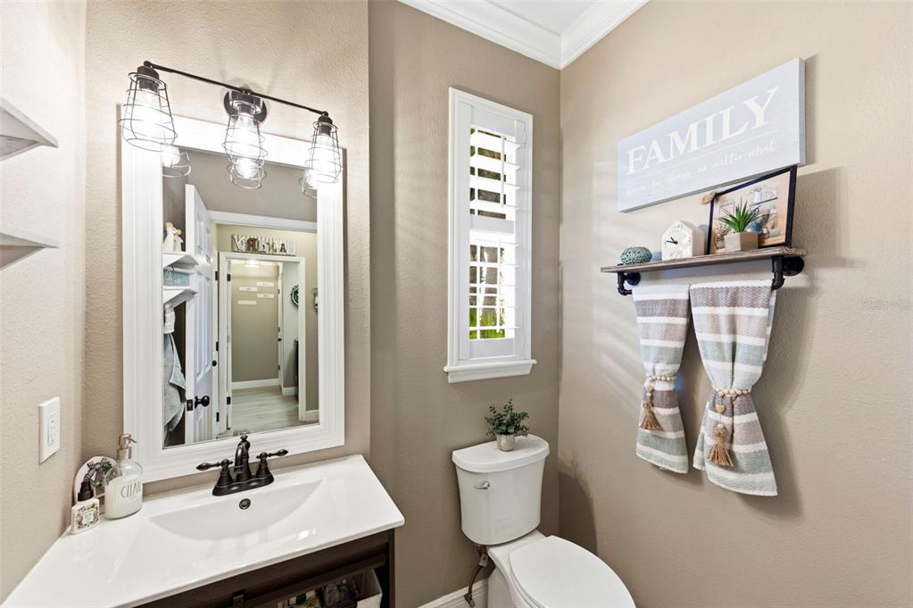8408 Shallow Creek Court New Port Richey, FL 34653 - Photo 21 of 47 a bathroom with a sink toilet and mirror