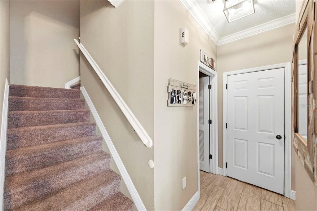 8408 Shallow Creek Court New Port Richey, FL 34653 - Photo 22 of 47 a view of entryway and hall with wooden floor