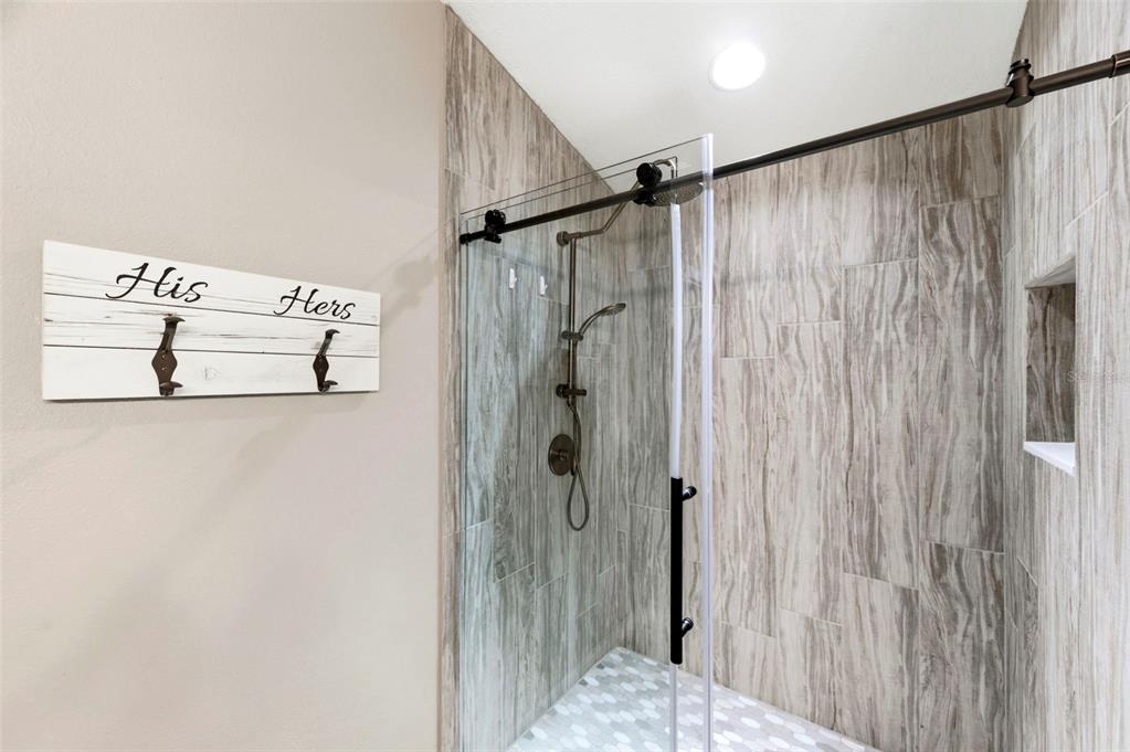 8408 Shallow Creek Court New Port Richey, FL 34653 - Photo 36 of 47 a bathroom with a shower and a shower curtain