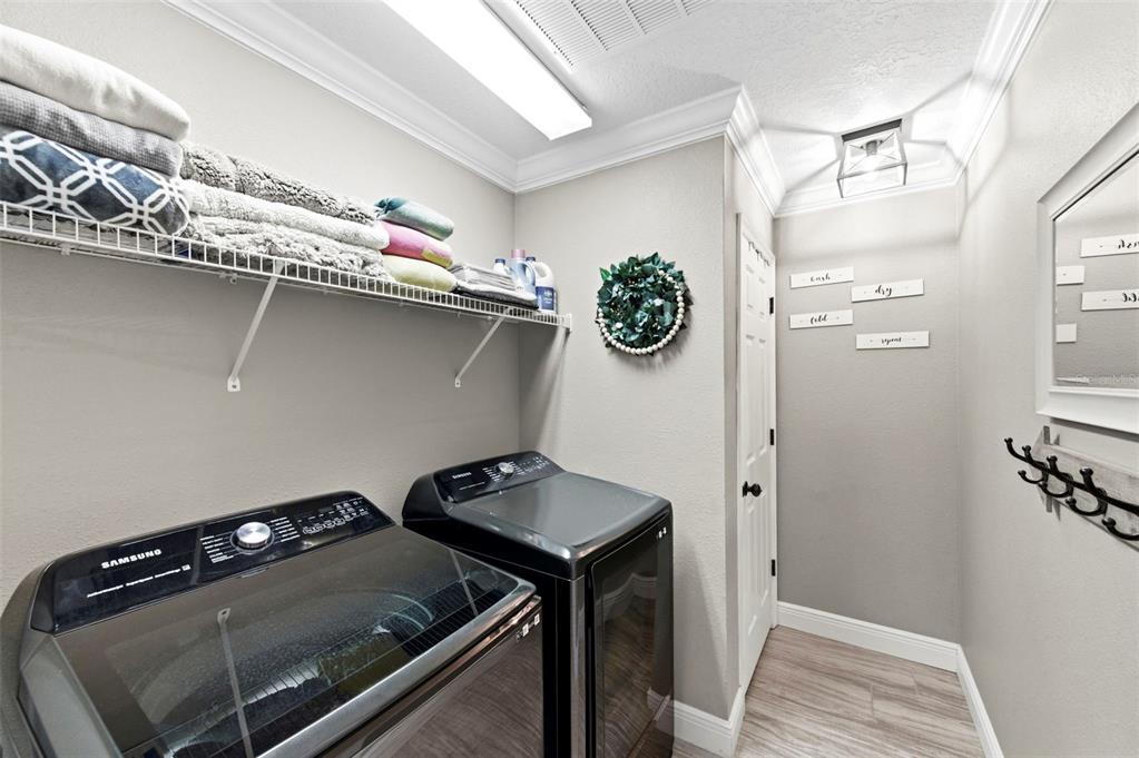 8408 Shallow Creek Court New Port Richey, FL 34653 - Photo 37 of 47 a utility room with dryer and washer
