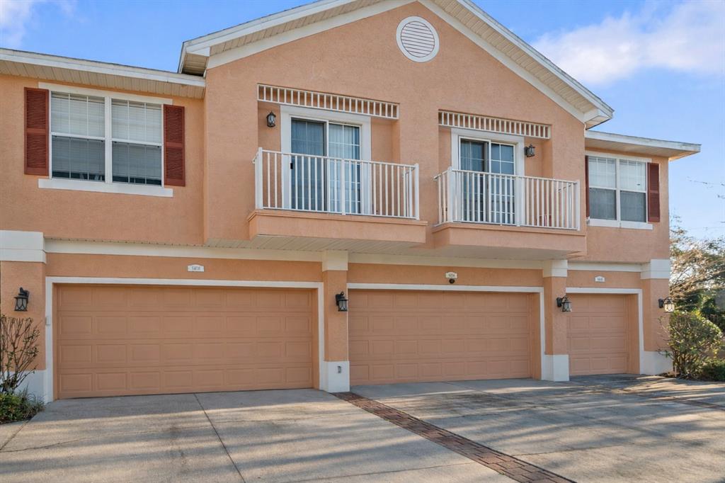 8408 Shallow Creek Court New Port Richey, FL 34653 - Photo 4 of 47 a view of a house with a garage