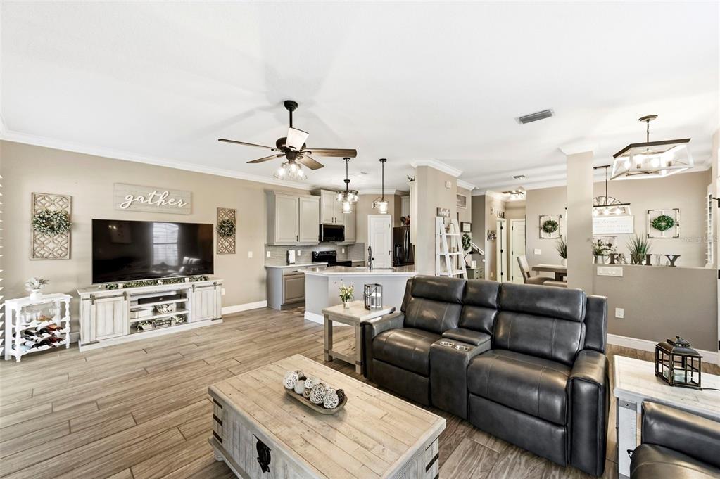 8408 Shallow Creek Court New Port Richey, FL 34653 - Photo 7 of 47 a living room with furniture and a flat screen tv