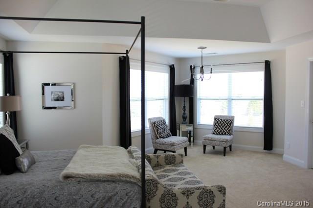 1028 Ridgehaven Road Waxhaw, NC 28173 - Photo 14 of 18 a bedroom with furniture and a window