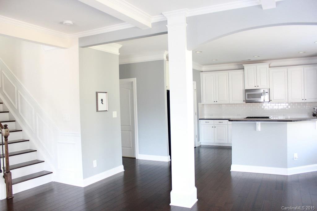 1028 Ridgehaven Road Waxhaw, NC 28173 - Photo 7 of 18 a view of a kitchen with wooden floor and electronic appliances