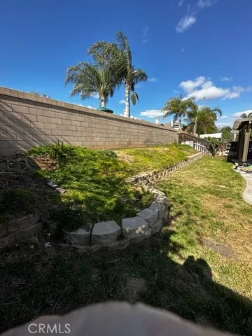a view of a backyard of the house
