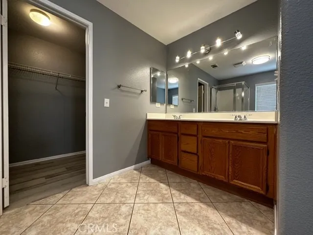 a bathroom with a sink and mirror
