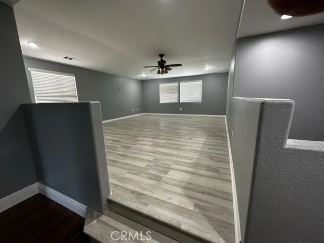 a view of a hallway to a bedroom