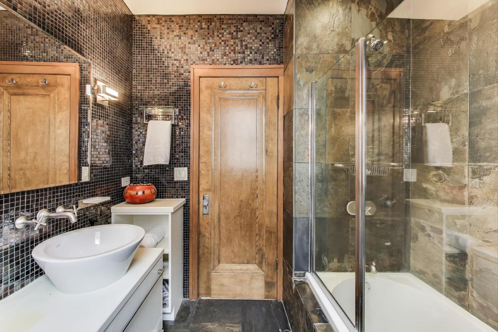 2700 West Carmen Avenue Chicago, IL 60625 - Photo 21 of 34 a bathroom with a sink and a mirror