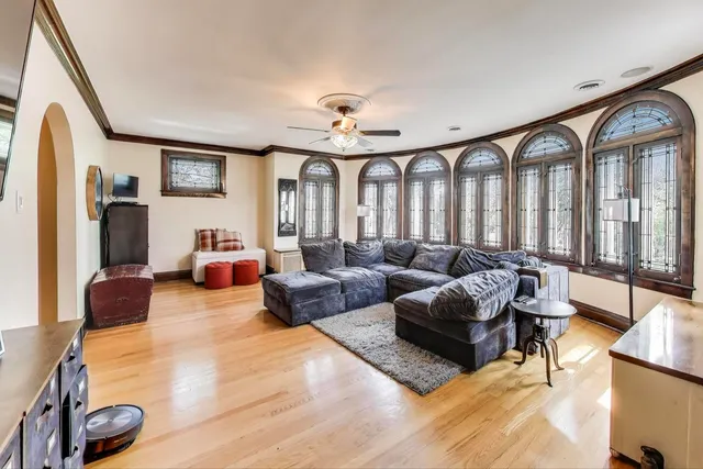a view of a livingroom with furniture window and wooden floor