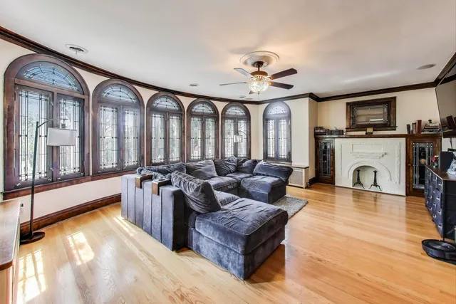 a living room with furniture and floor to ceiling windows