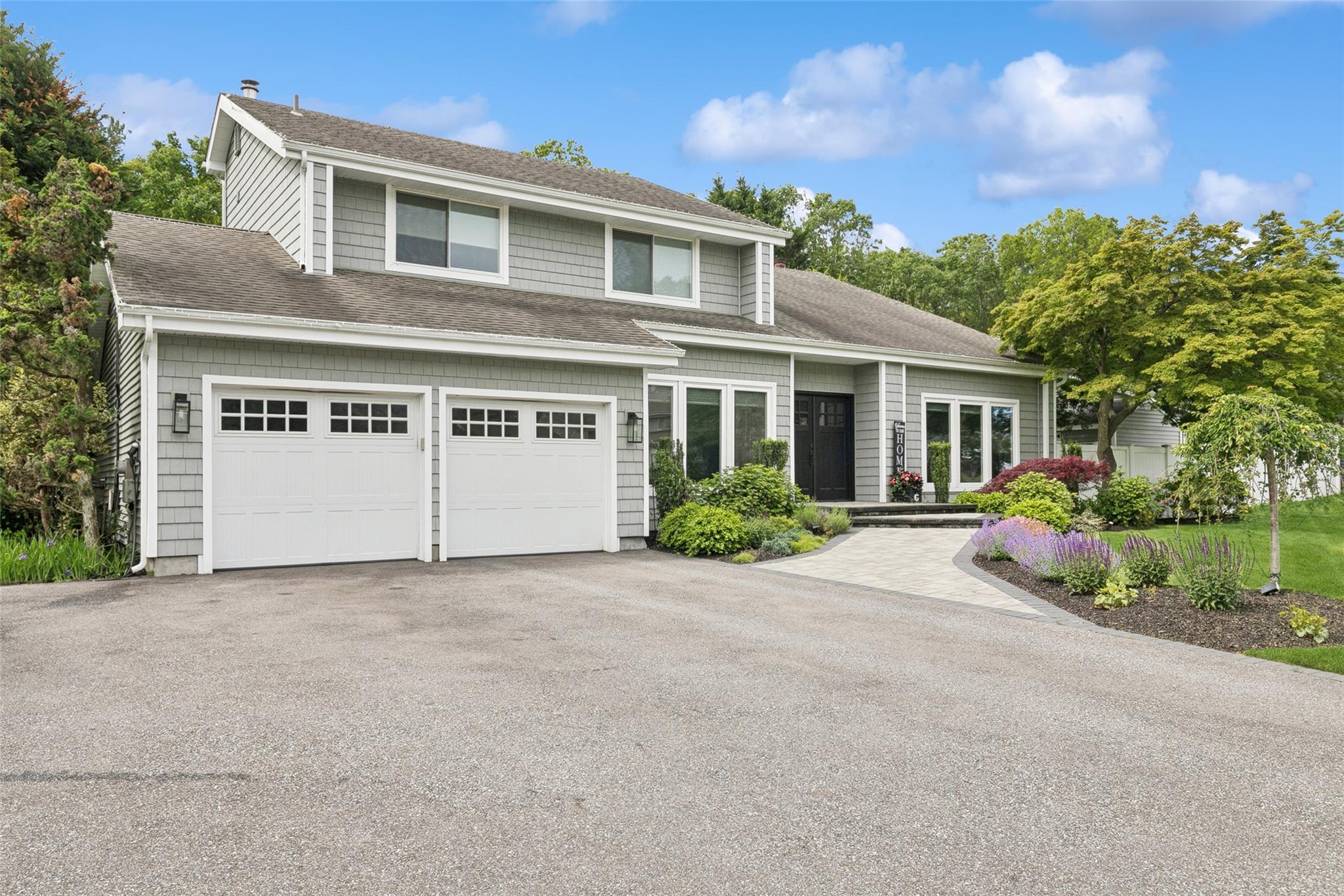 65 Timber Ridge Drive Commack, NY 11725 - Photo 1 of 1 front view of a house with a yard