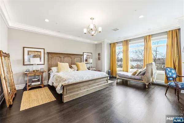 a spacious bedroom with a bed and a couch
