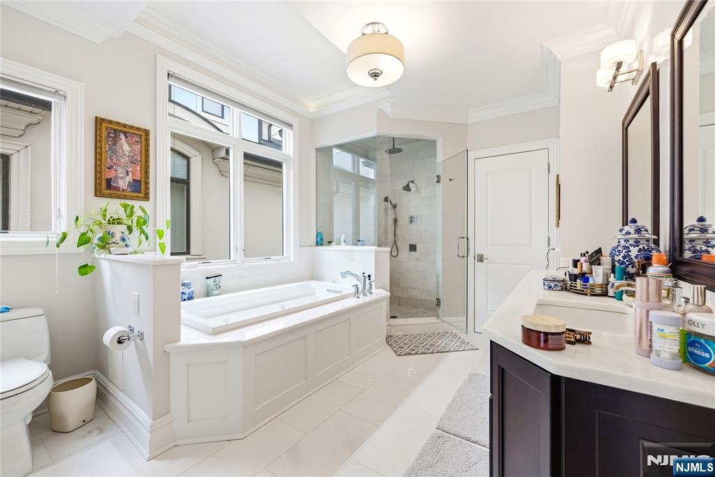 1228 River Road Edgewater, NJ 07020 - Photo 16 of 49 a bathroom with a sink a toilet and shower