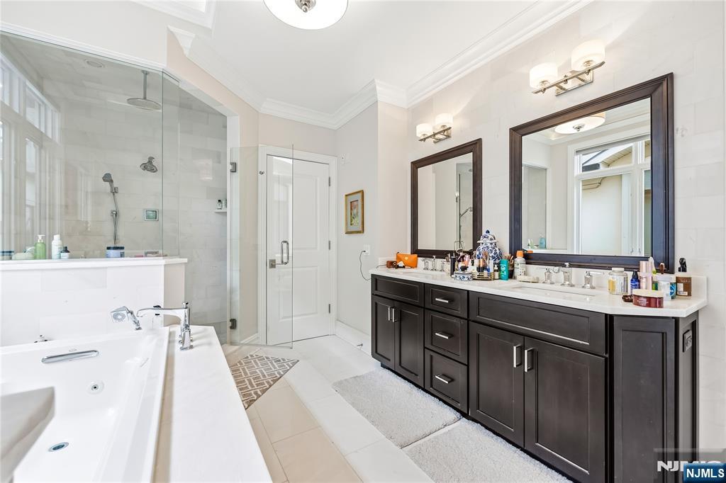 1228 River Road Edgewater, NJ 07020 - Photo 17 of 49 a spacious bathroom with a double vanity sink mirror double and shower