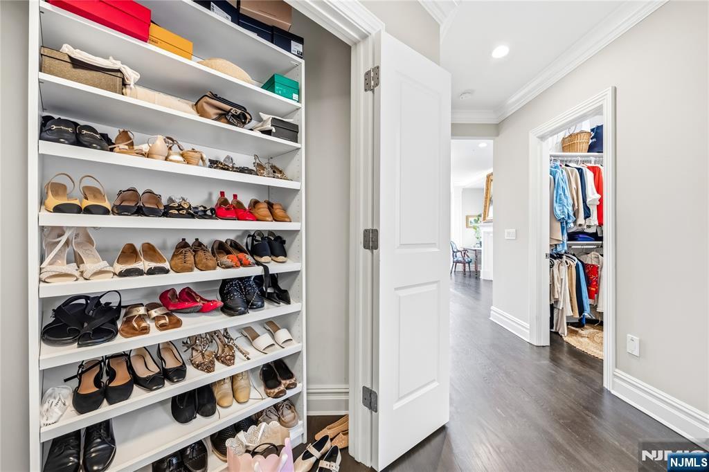 1228 River Road Edgewater, NJ 07020 - Photo 18 of 49 a room with a book shelf and a wooden floor