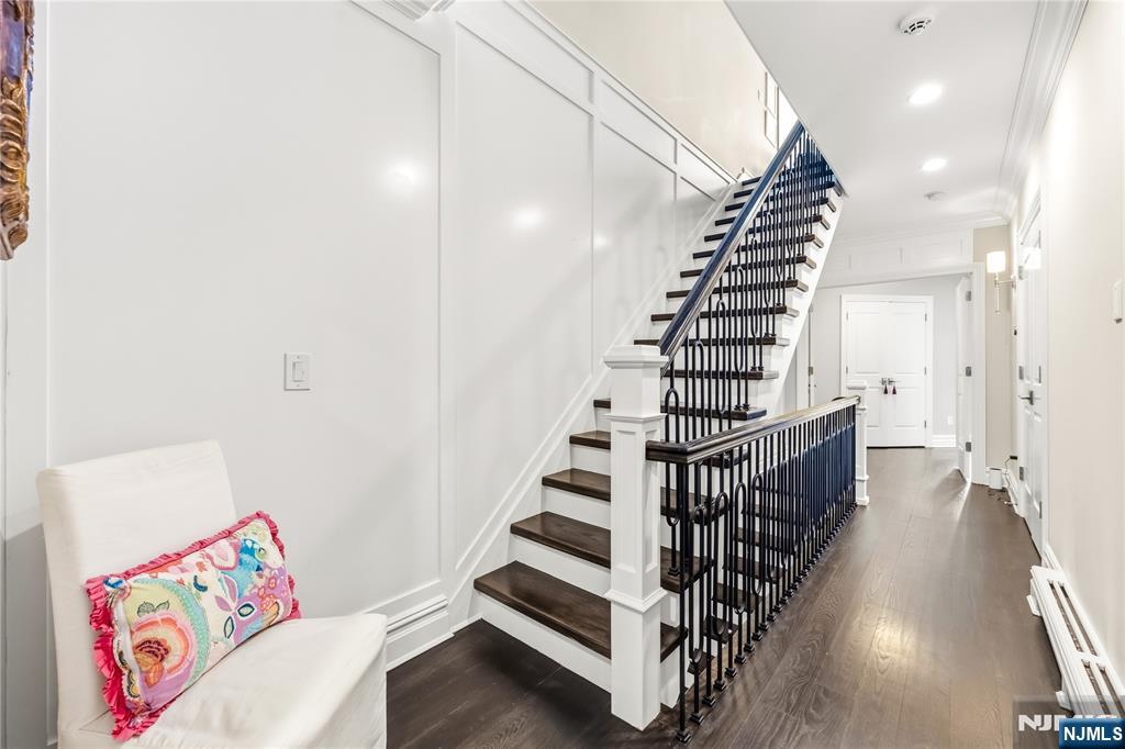 1228 River Road Edgewater, NJ 07020 - Photo 19 of 49 a view of entryway with stairs and wooden floor
