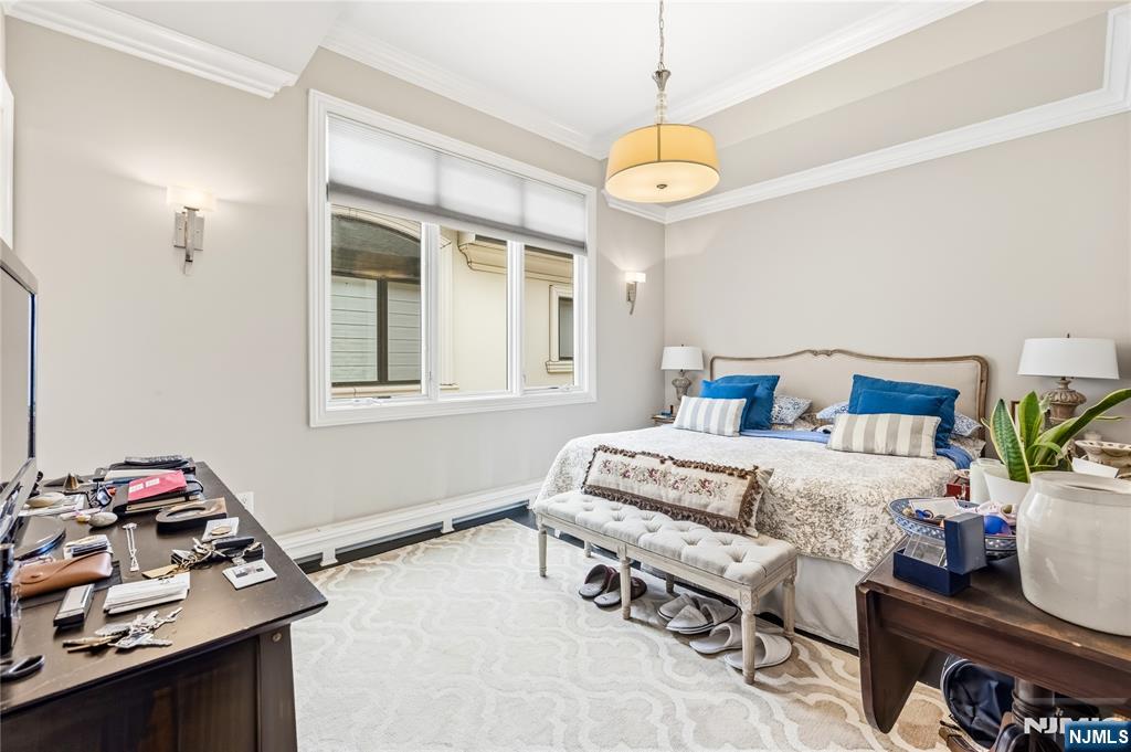 1228 River Road Edgewater, NJ 07020 - Photo 20 of 49 a bedroom with bed and a window